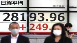 electronic stock board showing Japans Nikkei 225 index