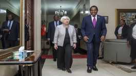 Janet Yellen walks with Hakainde Hichilema