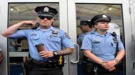 Police officers stand on guard