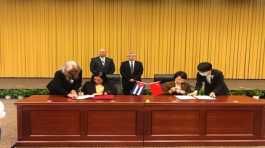 agreement was signed by Mayra Arevich and Cao Shuming